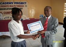 04 WHO Rep. presenting certificate to a student.