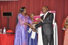 Cabinet Secretary James Macharia hands over the FCTC publication to Uganda Minister Sarah Opendi to celebrate Africa’s decade implementation of tobacco control