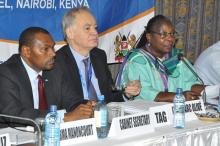  Dr Custodia Mandlhate, WR Kenya, speaks at the meeting. She is flanked by Dr Jean-Marc Olive, chair of the TAG and  Dr Joseph Sitienei, head of division, malaria and TB, MOH