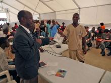  Acting representative of the WHO Liberia Country office Alex Gasasira handed over Certificates to Liberian health care workers.