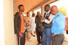 Dr. Patrick Abok discussing with boarder security personnel