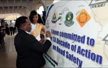 Office in Charge WHO signing road safety commitment