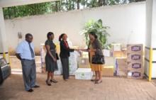 Dr Annet Kisakye WHO handing immunization supplies to Dr Immaculate Ampeire UNEPI