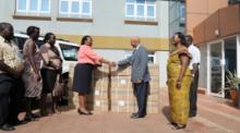 Dr Wondimagegnehu Alemu handing over blood collection bags to Dr. Dorothy Kyeyune UBTS