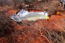 Hole covered with plastic sheeting