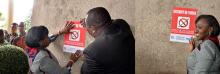 01 La Ministre ivoirienne de la sante, Dr Raymonde Goudou Coffie, aidee par le Vice Gouverneur du district d Abidjan, a affiche les 1er panneaux d interdiction de fumer sur les murs de l hotel du district.