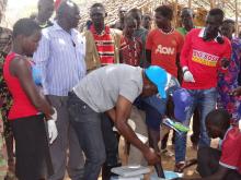 WHO, UNICEF and Kapoeta Officials checking the cold chain during support supervision, ensuring the correct technical standards are mantained during the OCV campaign