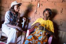 Rebecca Kalenga (left), an International Rescue Committee doctor, visits Pascaline and the other "relais communautaires" regularly, to mentor and monitor performance.