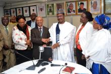 The WR (3rd left) handing over the equipment to the ED (3rd right) while NPHCDA and WHO officials witnessed the event