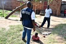 WHO staff talking to the population at Lugala landing site during the polio campaign support supervision exercise