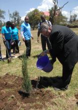 Dr Eggers waters a plant he has planted during the commemoration of World Mental Health Day in Gilgil, Nakuru County