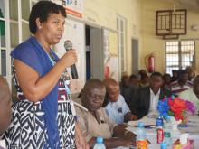 WHO staff member delivering a statement on behalf of the United Nations Family in Sierra Leone