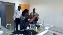 Setting up water quality control testing laboratory and demonstrating the components of the kit to the national public health laboratory technician in charge of water quality control testing and mo