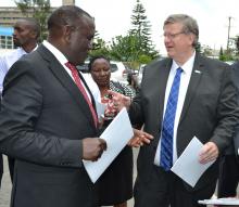 Health CS Dr Cleopa Mailu speaks with WR Dr Rudi Eggers at the event