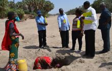  Team members at work as they evaluated water safety in Kerio area, Turkana County with the help of Assistant-Chief Vincent Chumi