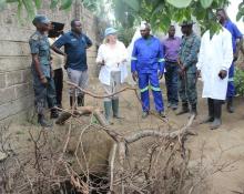 The District Director of Health for Lusaka, Dr. Namani Monze  and the United Nations Resident Coordinator, Ms Janet Rogan view one of the shallow water wells in the community.