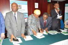 Dr. Matthieu Kamwa, WHO Representative a.i, discussing contents of the STG with Honourable Ummy Ally Mwalimu, Minister of Health, Community Development, Gender, Elderly and Children.  