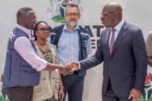 Warm shake hand between WHO incident Manager and Edo State Governor