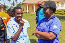 Minister of Health, Dr Diane Gashumba discussing with a CHW