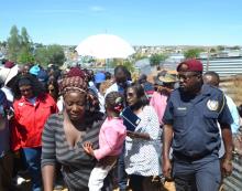 One of the community leaders after briefing the President on their collaboration with the City to maintain environmental hygiene in the community