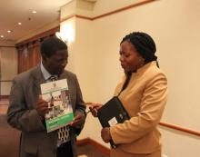 Health Promotion Officer at WHO, Nora Mweemba interviewing Mr geoffrey Chiyesu from the Retirees Welfare Bureau of Zambia on the organisation's expectations stance on UHC and the national policy on ageing. 