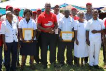 The Minister of Health standing 3rd from left with award winning nurses in tuberculosis treatement and care