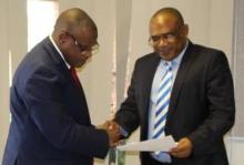 UB Vice Chancellor, Professor Morris, receiving the re-designation letter from Dr Ovberedjo