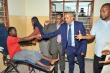 Health check up activities were conducted during the occasion. Dr. Andemichael greeting a member of the community who came for health check up.