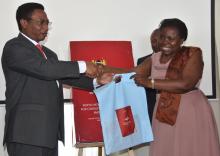 Dr Joyce Nato, WHO focal point for NCDs, receives a copy of the guidelines from Dr Kioko