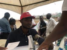 A community member checks at the  mobile diagnostic unit setup by by UNCDA to test for blood pressure and 