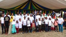 The Guest of Honor with the children who attended the event