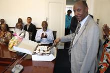 Dr Gasasira cutting the cake