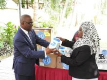 Hon Deputy Minister for Health, Ms Harusi Said Suleiman, receiving the items for Zanzibar 
