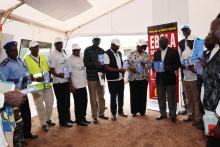 The high level Ebola Preparedness Team and the top leadership of Gbudue State posing for a group photo holding the key messages of Ebola at the Gangura screening facility, bordering DRC 