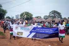 Community members match in procession to launch the campaign