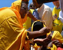 Health Cabinet Secretary Mrs Cecily Kariuki vaccinates a child