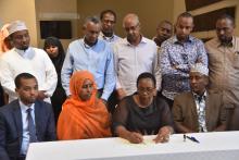 Kenya Health Cabinent Secretary Mrs Sicily Kariuki signs communique for polio eradication as other HOA members look on