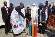 H.E Gen Taban and other dignitaries inspecting water source with different chlorine concetration