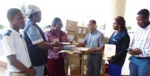 Dr. Mesfin G. Zbelo, Acting WR, Dr. Catherine Cooper Assistant Minister for Curative Services, MoH and some technical staffs during the handing over ceremony at the MOH in Monrovia 