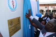 Unveiling the plaque at the triage of Dr John Garang Infections Disease Unit