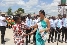 Ms Tamaryn Green, who is Miss South Africa congratulates school girls following a performance during the World TB Day commemoration