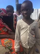 Elena and her children Felipe and Luisa are first in line for the oral cholera vaccination in Beira