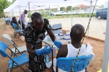 A frontline health worker receiving Ebola vaccine