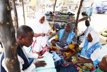 WHO personnel briefing transit immunization teams