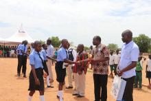 Dr Pinyi congratulating the winners of the schools debate