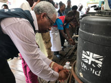 The WHO Country Representative for Uganda washing his hands