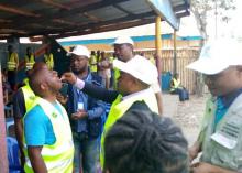 A local official receives a dose of oral cholera vaccine in Tshilenge, July 2019