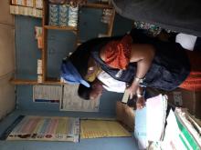 WHO’s Ima Okon and Nurse Sesefu Ayenajeh reviewing the routine immunization register at Aso Pada PHC, Nassarawa State