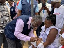 Director General of the Ghana Health Service, Dr Nsiah Asare vaccinating a baby
