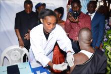 A nurse administering J&J Vaccine in the launching ceremony